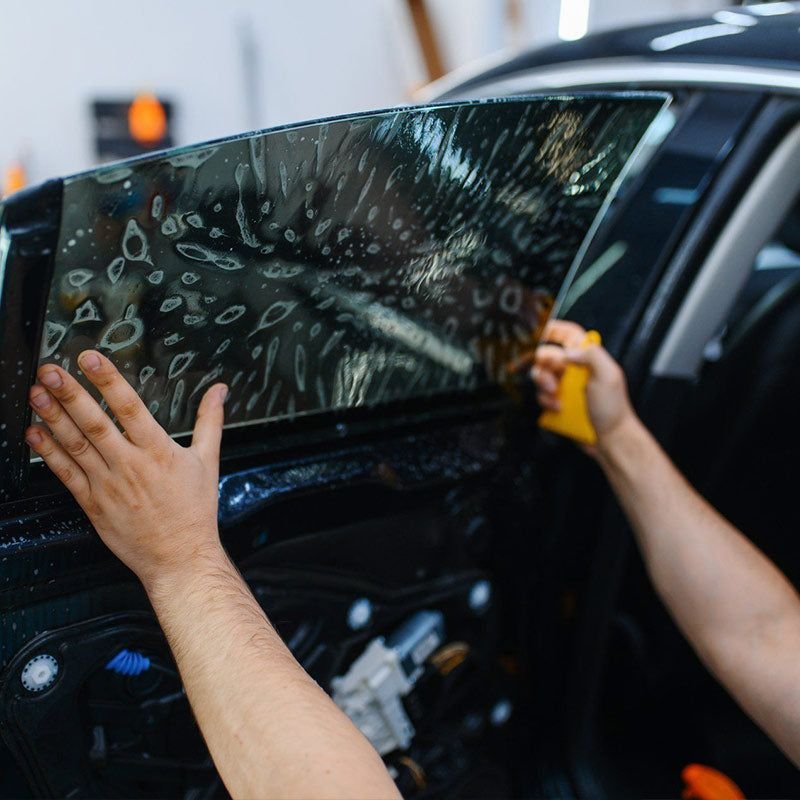 Dark automotive glass on a modern vehicle